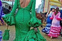 A Woman wearing flamenco dress at the April Fair in Seville, Spain
