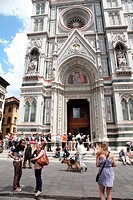 Tourists in front of the facade of Santa Maria del Fiore cathedral, Piazza del Duomo, Florence, Italy