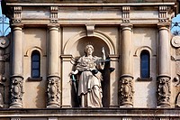 Justitia, Lady Justice, standing with scale and sword on the facade of the Strafjustiz Gebaude criminal justice building in Hamburg, Germany