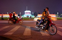A couple in front of Ho Chi Minh Mausoleum at night