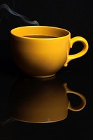 Yellow Coffe Cup On Dark Background