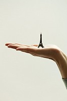 Girl`s hand with Eiffel Tower