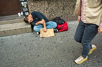 New York, NY, USA, Homeless Man Sleeping on Sidewalk holding Sign in, Chinatown, Manhattan