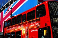 Oxford Street view during the London 2012 Olympics with the Union Flag draped John Lewis department store and a red London double-decker bus