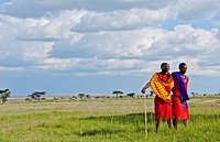 Kenya Masai Mara reserve with space and two Masai warriors and clouds in Masai Mara National Park in reserve 8