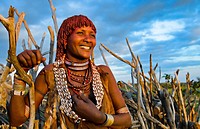 Turmi Ethiopia Africa Lower Omo Valley village with Bena Tribe First Wife smiling in sunset in wood hut village 24