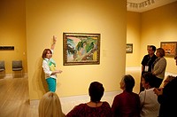 USA, Indiana, Indianapolis, docent leading tour of paintings at Indiana Museum of Art