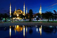 Blue Mosque lit at dusk with reflection in fountain Istanbul Turkey