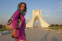 Caucasian woman at Azadi Tower, or King Memorial Tower, Teheran, Iran