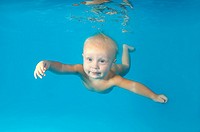 Baby diving in a pool