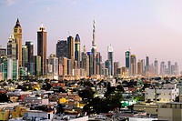 view across old Al Satwa district towards modern skyline of Dubai with skyscrapers in United Arab Emirates