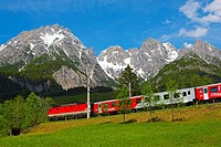 Passenger train on the Griesenpass in spring