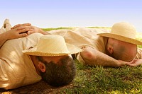 Two men in sleeping during siesta time in Valencia, Spain