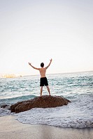 Man Celebrating On Beach