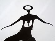 shadow of corkscrew with human shape.