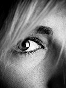 Close up of the eye of a young attractive caucasian woman, black and white.