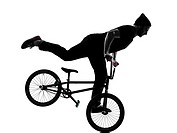 one caucasian man exercising bmx acrobatic figure in silhouette studio isolated on white background.