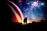 Couple in sillhouette with space background.