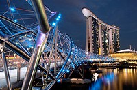 Marina Bay Sands hotel designed by the architect Moshe Safdie in the evening, viewed from the Helix bridge. Singapore, Marina Bay.
