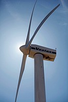 Vestas wind turbine, close against blue sky.