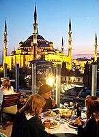 People dining at The Blue House Hotel Restaurant, Sultanahmet, Istanbul, Turkey.