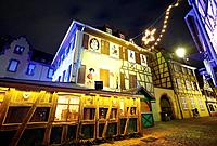 Hansi drawings Christmas decoration by night at the Little Venice. Colmar. Wine route. Haut-Rhin. Alsace. France.