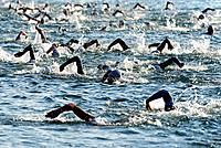 athletes swimming in Lake Geneva, first race of International Geneva Triathlon, on July 21, 2013, Geneva, Lake Geneva, Switzerland
