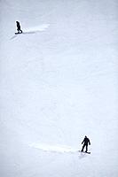 Men skiing in a resort.