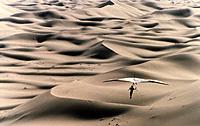 Hangliding over the dunes of the Sahara Desert.