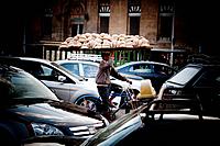 Transporting bread bike through the busy streets of Cairo.
