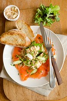 Smoked salmon salad with crab dressing and rocket with toast.