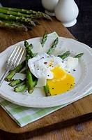 Griddled asparagus with poached egg and grated Parmesan.