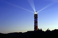 Lighthouse with light beam in the night, Amrum, Northfrisian Islands, Schleswig-Holstein, Germany, Europe.