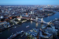 Aerial view of London at night with the Tower Bridge in the foreground, England, Great Britain, United Kingdom, Europe.