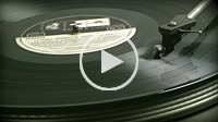 Turntable profile of black 33 rpm record playing on a vinyl record player