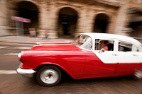 Dynamic scene of an old american car, Prado, Havana, Cuba, West Indies, Central America.