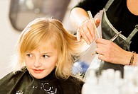 hair care - little girl at a hairdressing salon.