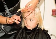 hair care - little girl at a hairdressing salon.