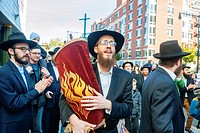 Rabbi Yossel Gansbourg of the Chabad of Harlem celebrates the completion of their Sefer Torah in a Torah parade Hachnasat Sefer Torah through the stre...