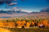 Fall foliage landscape with Mt. Mansfield in the background, Stowe, Vermont, USA.