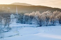 Sunrise over Stowe Community Church on a cold winter morning, Stowe, Vermont, USA.