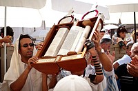 Jewish Child showing the Torah scroll Bar Mitzvah in Western Wall Jerusalem.