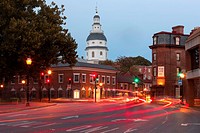 Evening traffic on Church Circle in Annapolis, Maryland creates streaks of light in front of the Maryland State House, opened in 1772, the oldest US s...