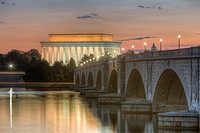 The Arlington Memorial Bridge spans the Potomac River leading to the Lincoln Memorial shortly before sunrise.