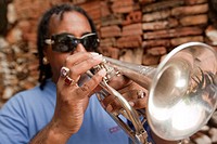 Cuban musician playing trumpet, Trinidad, Cuba, Antilles, Central America.