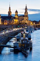 river Elbe with ships, Dresden Castle, appellate court and Dresden Cathedral at night, Dresden, Saxony, Germany.
