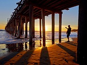 Silhouette of man at beach during sunset in Cayucas, California, United States.