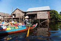 Cambodian woman on the boat in the floating village in Tonle Sap lake in Cambodia.