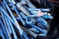 old blue plastic tubes on a building site