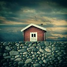 Digital composite of a red timber house against sunset, Oslo Norway